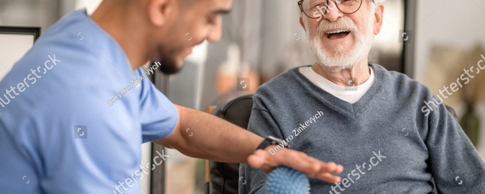 stock-photo-patient-having-his-hand-massaged-with-a-spiky-massage-ball-2154952883